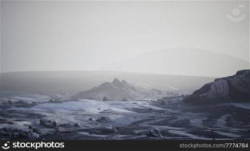 Antarctic mountains with snow in fog
