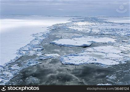Antarctica, Weddell Sea, Ice floe, clouds reflecting in water