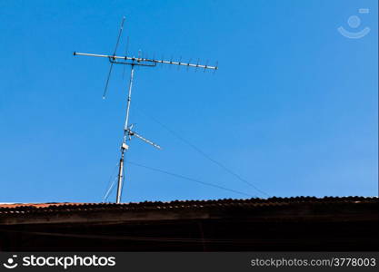 Antenna on the roof with blue sky in Thailand