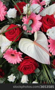 Anthurium, roses and gerberas in red, pink and white in a bridal flower arrangement