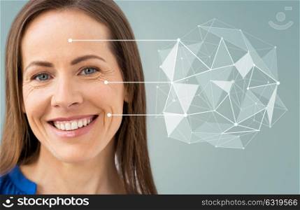 anti-age, people and beauty concept - beautiful middle aged woman with low poly shape and pointers on her face over gray background. middle aged woman with pointers on her face