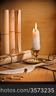 antic candle with rool of paper