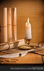antic candle with rool of paper
