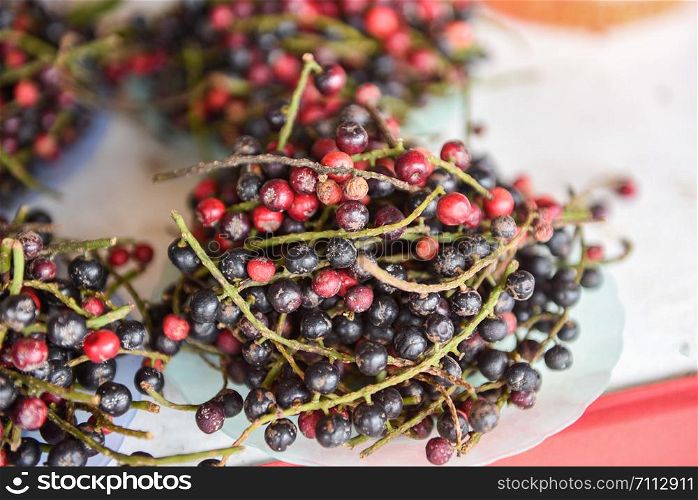 Antidesma thwaitesianum fruit Thai Blueberry in the local fruit in northeastern red wild berry in Asia / puncticulatum Miq Stilaginaceae