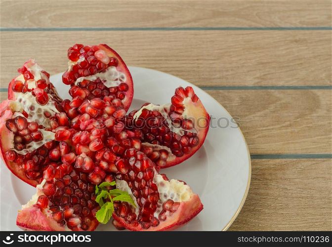 antioxidant pomegranate for healthy life, in white plate