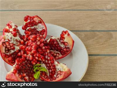 antioxidant pomegranate for healthy life, in white plate