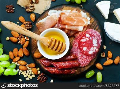 antipasti on white plate and on a table