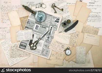 antique accessories, old letters and postcards, vintage ink pen. nostalgic sentimental background. ephemera and newspaper