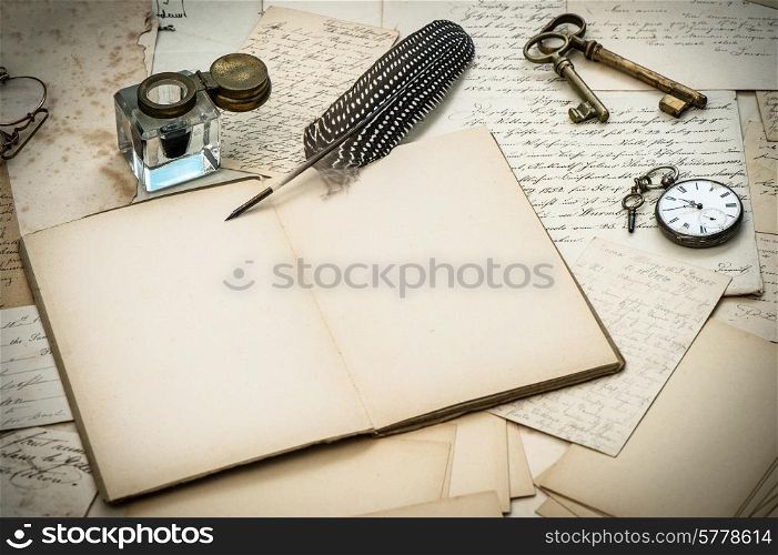 antique accessories, old letters, inkwell and vintage feather ink pen. nostalgic style background