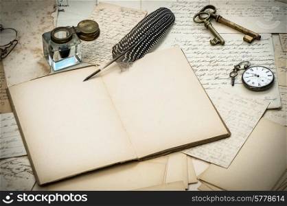 antique accessories, old letters, inkwell and vintage feather ink pen. nostalgic style background