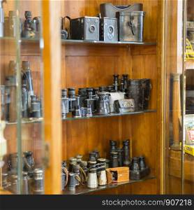 Antique Black Binoculars inside a Display Case with Showcase.. Antique Black Binoculars inside a Display Case with Showcase
