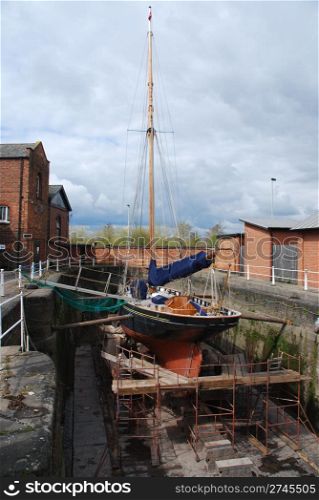 antique boat reparation at dry docks (cloudy weather)