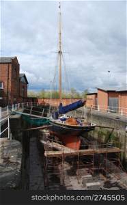 antique boat reparation at dry docks (cloudy weather)