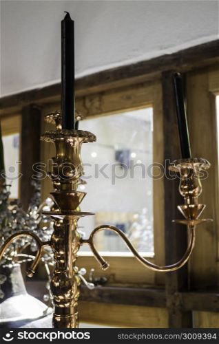 Antique candleholder with black candles