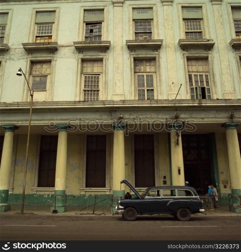 Antique car parked in front of a building, Havana, Cuba