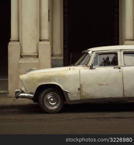 Antique car parked outside a building, Havana, Cuba