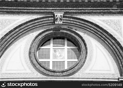 antique contruction in italy europe marble and rose window the wall