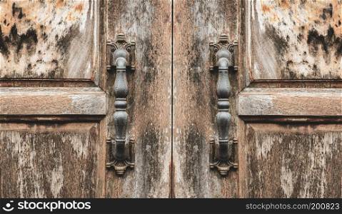 Antique door handle  of grunge wooden door