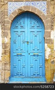 antique door in morocco africa blue wood and metal rusty