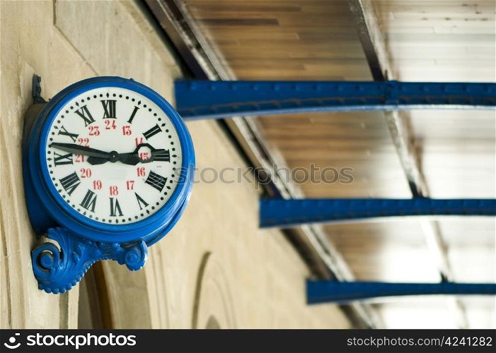 Antique external blue clock on railway station