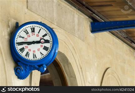 Antique external blue clock on railway station