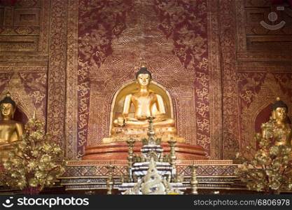 antique golden buddha statue in buddhism temple