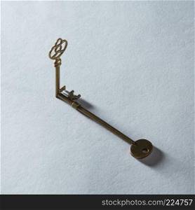Antique golden door keys with shadow isolated on grey background. Blank copy space may be used for any emotions, ideas, feelings.. Key represented on background