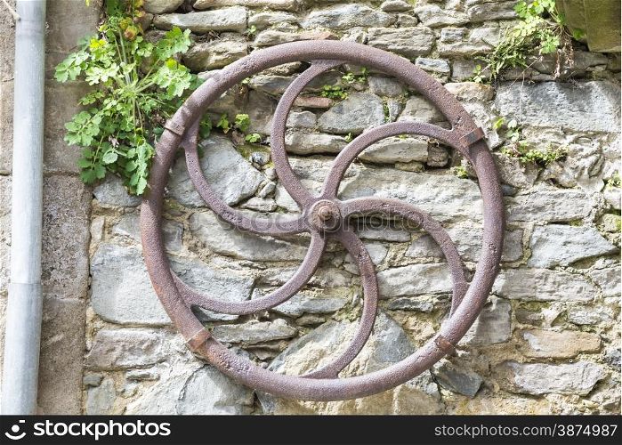 antique iron wheel to draw water