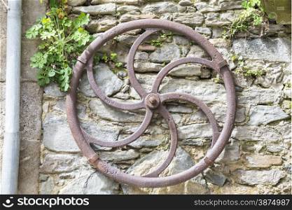 antique iron wheel to draw water
