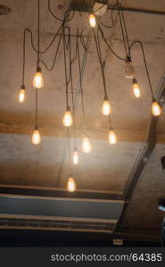 Antique light bulbs hanging on the ceiling, stock photo