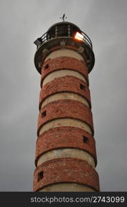 antique lighthouse with red bricks