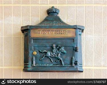 Antique metal letter box on the wall