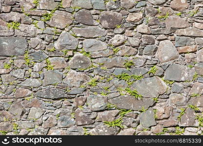 Antique natural stonewall, old stones in different sizes