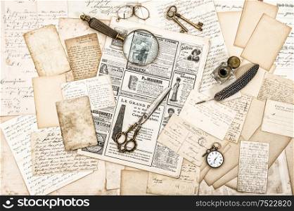 Antique office accessories, old letters and postcards, old ink pen. Nostalgic paper background. Vintage style toned picture