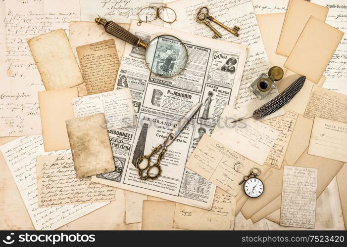 Antique office accessories, old letters and postcards, vintage ink pen. Nostalgic paper background. Ephemera and newspaper