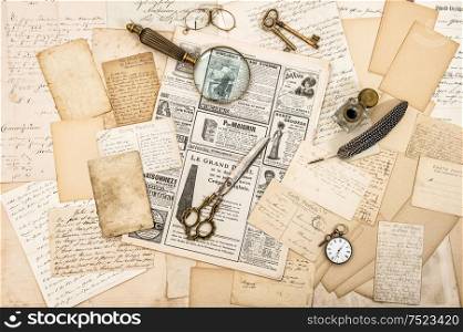 Antique office accessories, old letters and postcards, vintage ink pen. Nostalgic paper background. Ephemera and newspaper