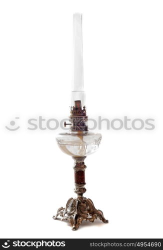 antique oil lamp in front of white background