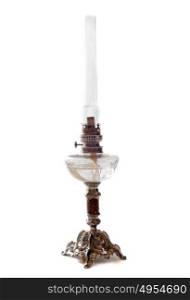 antique oil lamp in front of white background