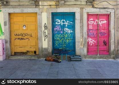 Antique Portuguese Architecture: Old Colorful Doors, Writings and Guitar in the Street - Portugal. Antique Portuguese Architecture: Old Colorful Doors, Writings an