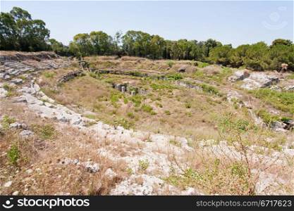 antique Roman amphitheater in Syracuse, Sicily, Italy