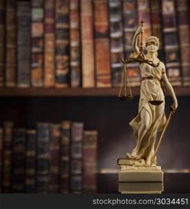 Antique statue of justice, law, books background. Judge gavel and scales of justice and book background
