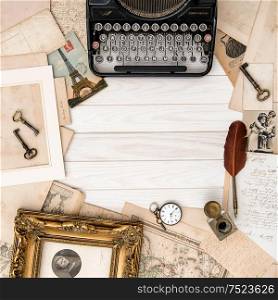 Antique typewriter and vintage office accessories on wooden table. Flat lay still life