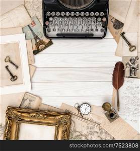 Antique typewriter and vintage office tools on wooden table. Flat lay