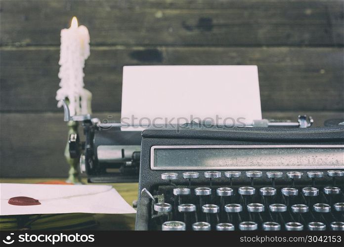 Antique typewriter. Old typewriter with paper and envelope