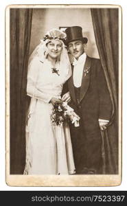 Antique wedding photo. Just married couple. Nostalgic picture with original scratches and film grain