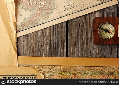Antique wooden compass over old map
