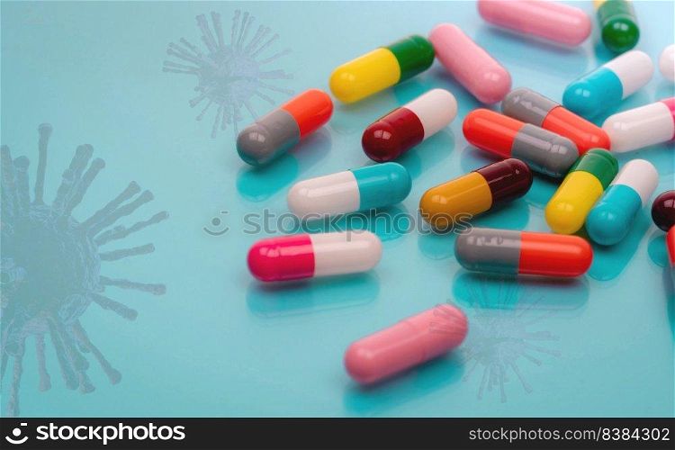 Antiviral capsule pills with virus on blue background. Drug development and new drug research for treatment emerging infectious diseases. Prescription drugs. Pharmaceutical industry. Pharmacology.