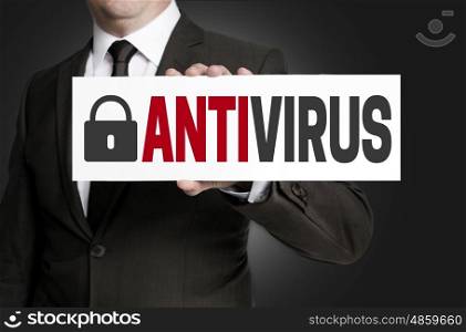 antivirus placard is held by businessman. antivirus placard is held by businessman.