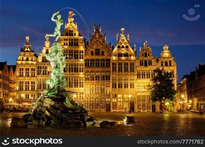 Antwerp famous Brabo statue and fountain on Grote Markt square illuminated at night and old houses. Antwerp, Belgium. Antwerp Grote Markt with famous Brabo statue and fountain at night, Belgium