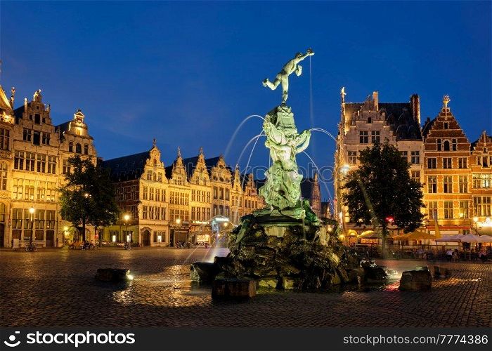 Antwerp famous Brabo statue and fountain on Grote Markt square illuminated at night and old houses. Antwerp, Belgium. Antwerp Grote Markt with famous Brabo statue and fountain at night, Belgium